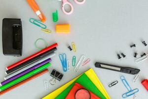 Photo of office and student gear over white background - Back to school concept