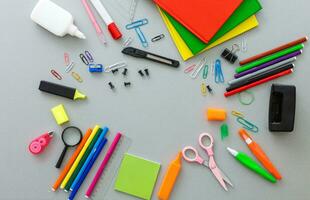 Photo of office and student gear over white background - Back to school concept