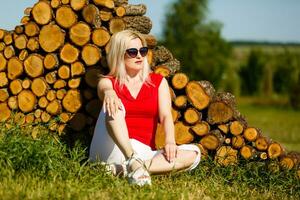 Beautiful Young Woman Outdoors. Enjoy Nature. Healthy Smiling Girl in Green Grass. photo