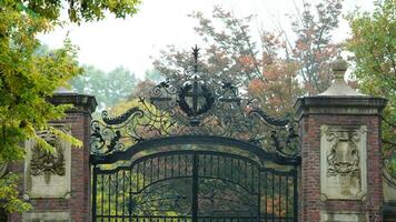 The beautiful campus autumn view with the colorful trees and leaves in the rainy day photo