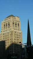 The city view with the old buildings and architectures under the warm sunlight photo