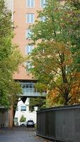 The beautiful campus autumn view with the colorful trees and leaves in the rainy day photo