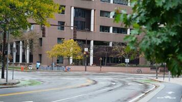 The beautiful campus autumn view with the colorful trees and leaves in the rainy day photo