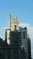 The city view with the old buildings and architectures under the warm sunlight photo