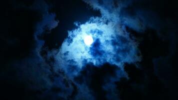 The moon night view with the full moon and clouds in the sky photo