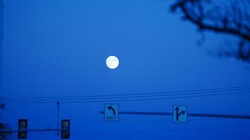 The moon night view with the full moon and clouds in the sky photo