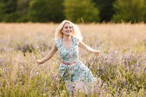 beautiful girl in a summer field photo