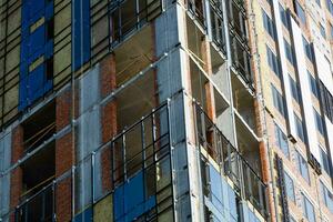 Thermal insulation of a house wall on a building site photo