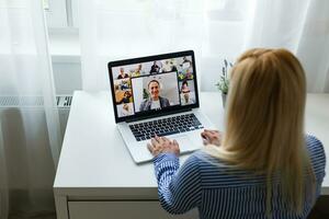 Cropped Image Of Businesswoman Using Laptop At Desk photo