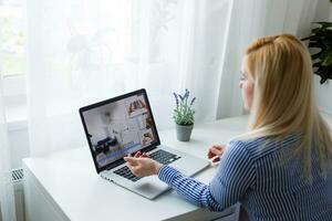 Female person sitting front open laptop computer, modern businesswoman work in internet via notebook, student photo