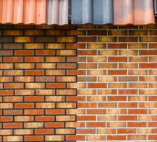 red brick wall house roof details closeup photo