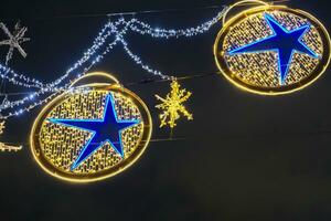 Decorated and illuminated Christmas street lights in London, UK photo