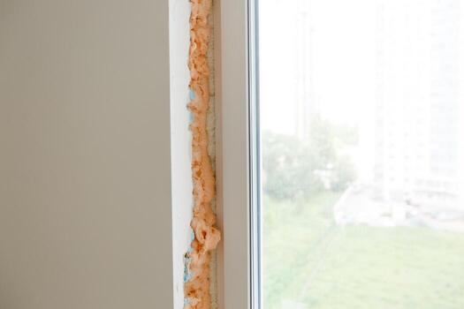 Process installation slopes of window. Using a moanting foam. photo