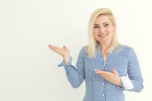 Portrait of emotive good-looking caucasian woman laughing while looking aside and standing against white background. photo