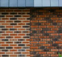 red brick wall house roof details closeup photo