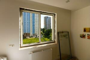 Process installation slopes of window. Using a moanting foam. photo