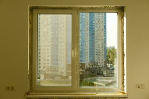 Process installation slopes of window. Using a moanting foam. photo