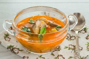 vegetable tomato soup with fish in a plate photo