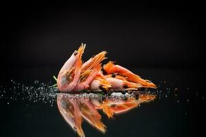 boiled shrimp with spices on black background photo