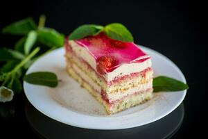 strawberry poppy cake with cream in a plate photo