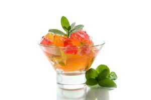 colored sweet fruit jelly in a glass glass photo