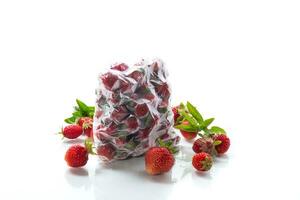 frozen fresh strawberries in a vacuum bag photo