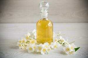 medicinal herbal tincture with jasmine in a glass bottle photo