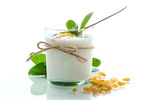 sweet homemade yogurt with raisins in a glass photo