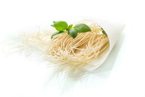 homemade thin dried egg noodles in paper bag with basil photo