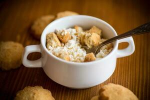 Homemade cottage cheese with pieces of shortbread cookies for breakfast photo