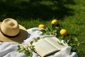 ai generado almuerzo descanso en el parque. picnic cobija con un abierto libro, limones, playa bolso y ancho borde Paja sombrero en un jugoso verde recién recién cortado césped. generativo ai. foto