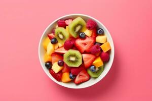 AI generated Bowl of healthy fresh fruit salad on pink background, top view. generative ai. photo