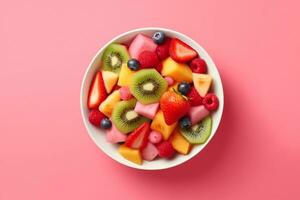 AI generated Bowl of healthy fresh fruit salad on pink background, top view. generative ai. photo