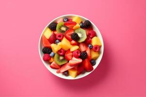 AI generated Bowl of healthy fresh fruit salad on pink background, top view. generative ai. photo