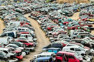 a large number of cars are parked in a lot photo