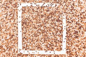 glittering background of Peach Fuzz sequins closeup. Sparkle festive texture. white frame for your text photo