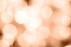 christmas beautifull shiny Peach Fuzz background. sparkle festive blurred bokeh photo