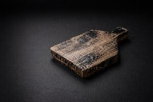 Empty wooden cutting board for preparing ingredients for preparing a delicious dish photo