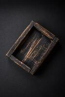 Empty rectangular wooden cutlery box on textured concrete background photo