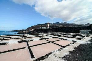 salt ponds on the beach near the ocean photo