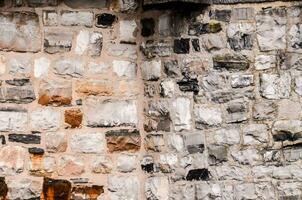 a stone wall with many different colors photo