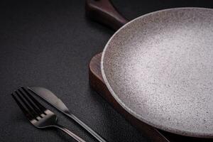 Empty round ceramic plate as an item of kitchen utensils photo