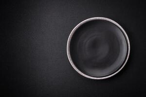 Empty round ceramic plate as an item of kitchen utensils photo