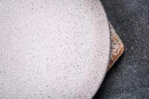 Empty round ceramic plate as an item of kitchen utensils photo