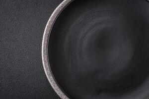 Empty round ceramic plate as an item of kitchen utensils photo