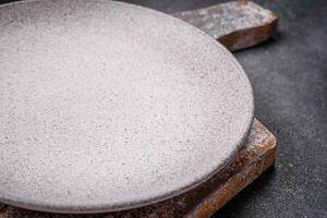 Empty round ceramic plate as an item of kitchen utensils photo