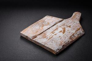 Empty wooden cutting board for preparing ingredients for preparing a delicious dish photo