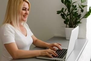 Happy woman doing online shopping at home photo