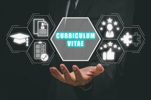 Curriculum vitae concept, Businessman hand holding curriculum vitae icon on virtual screen, HRM and recruitment, qualification, cv, resume, skills. photo