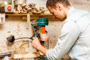 Image of mature carpenter in the workshop photo